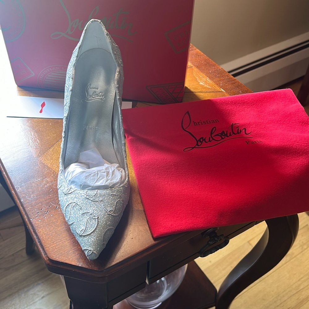 New with box- dust bag- Red Bottom pumps! Size 8- silver shiny